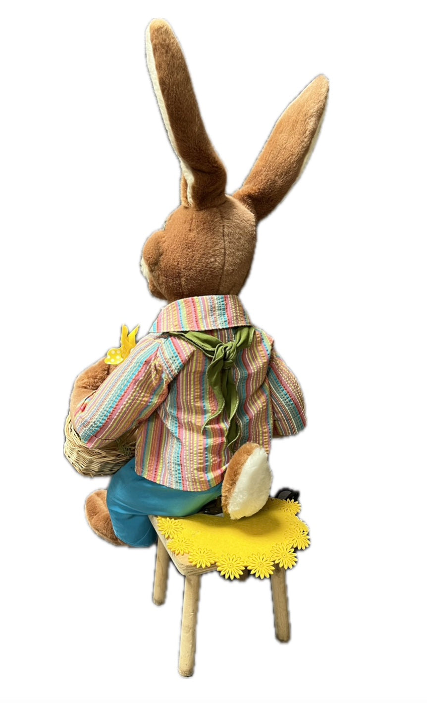 Sitting rabbit with basket and piece of melon