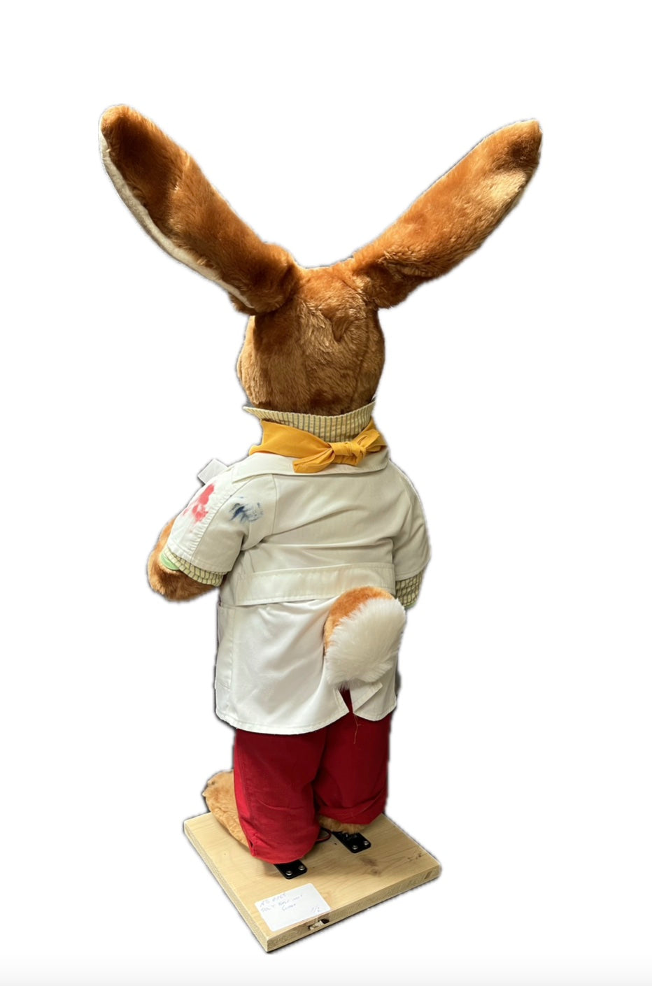 Rabbit with yellow scarf brings eggs