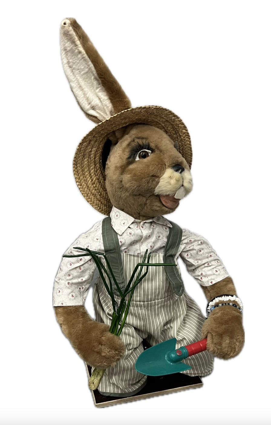 Rabbit with planting shovel, kneeling 