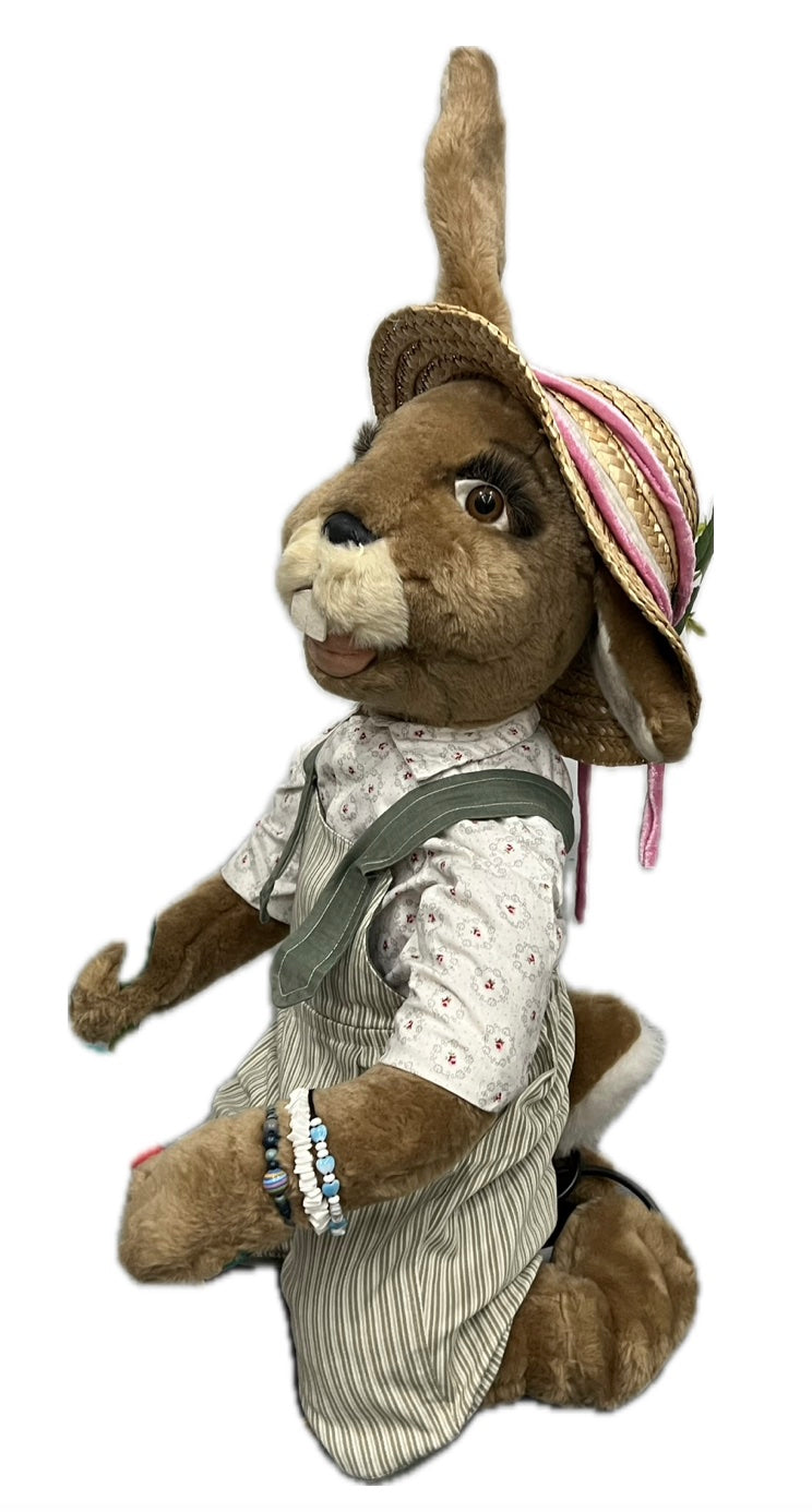 Rabbit with planting shovel, kneeling 