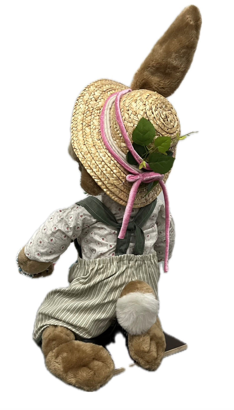 Rabbit with planting shovel, kneeling 