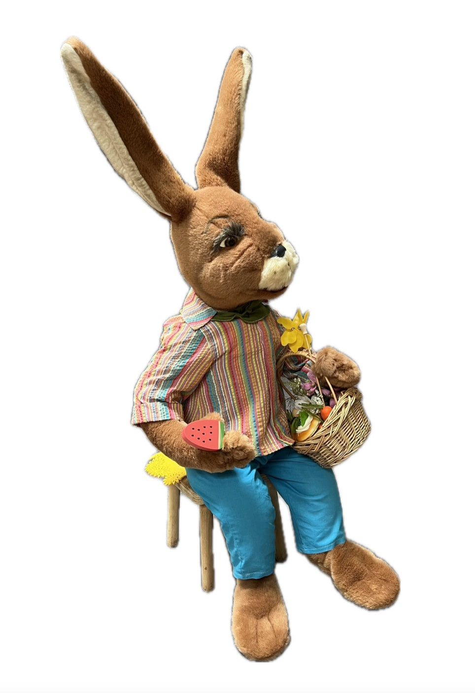 Sitting rabbit with basket and piece of melon 