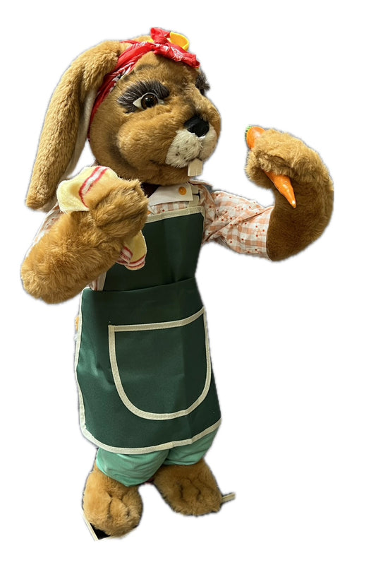 Rabbit with green garden apron, carrot and cloth