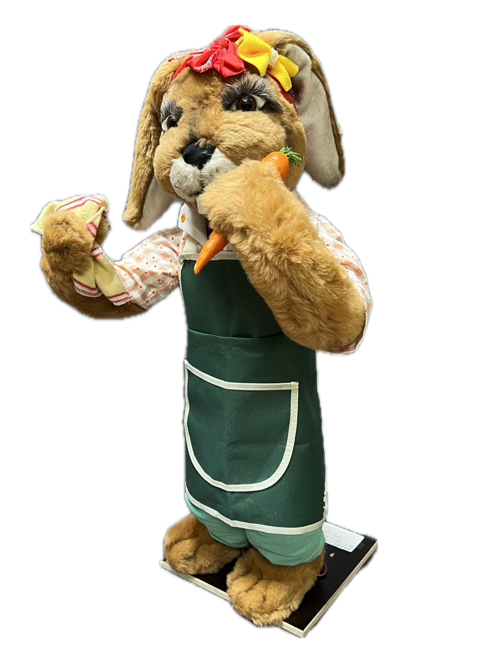 Rabbit with green garden apron, carrot and cloth