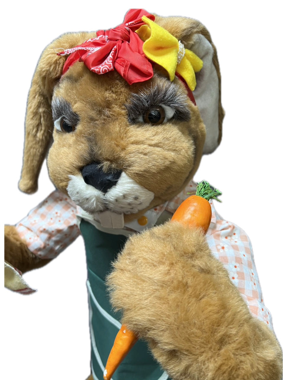 Rabbit with green garden apron, carrot and cloth