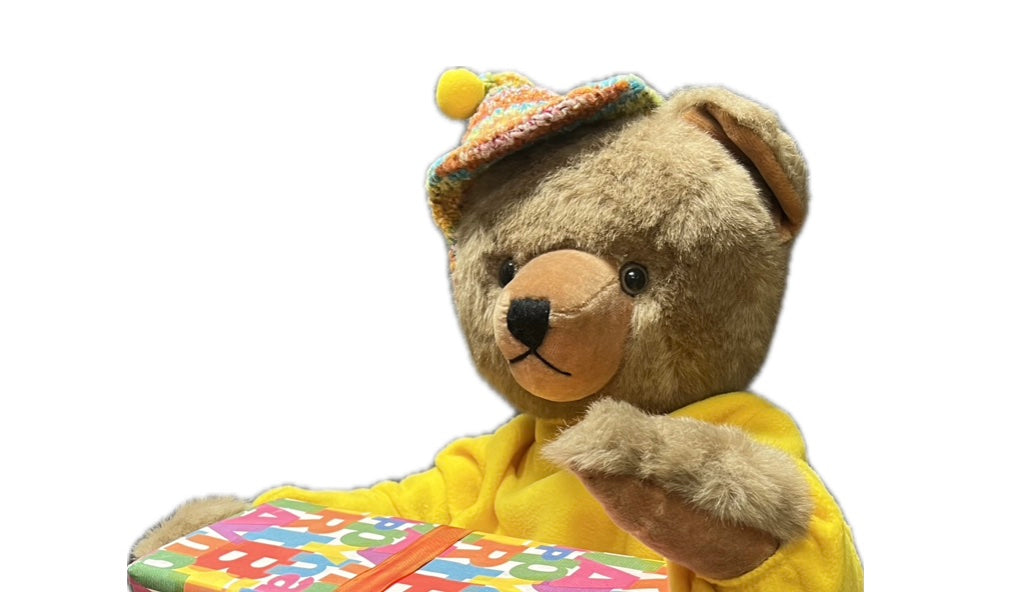 Teddybär mit großem Geschenkpaket
